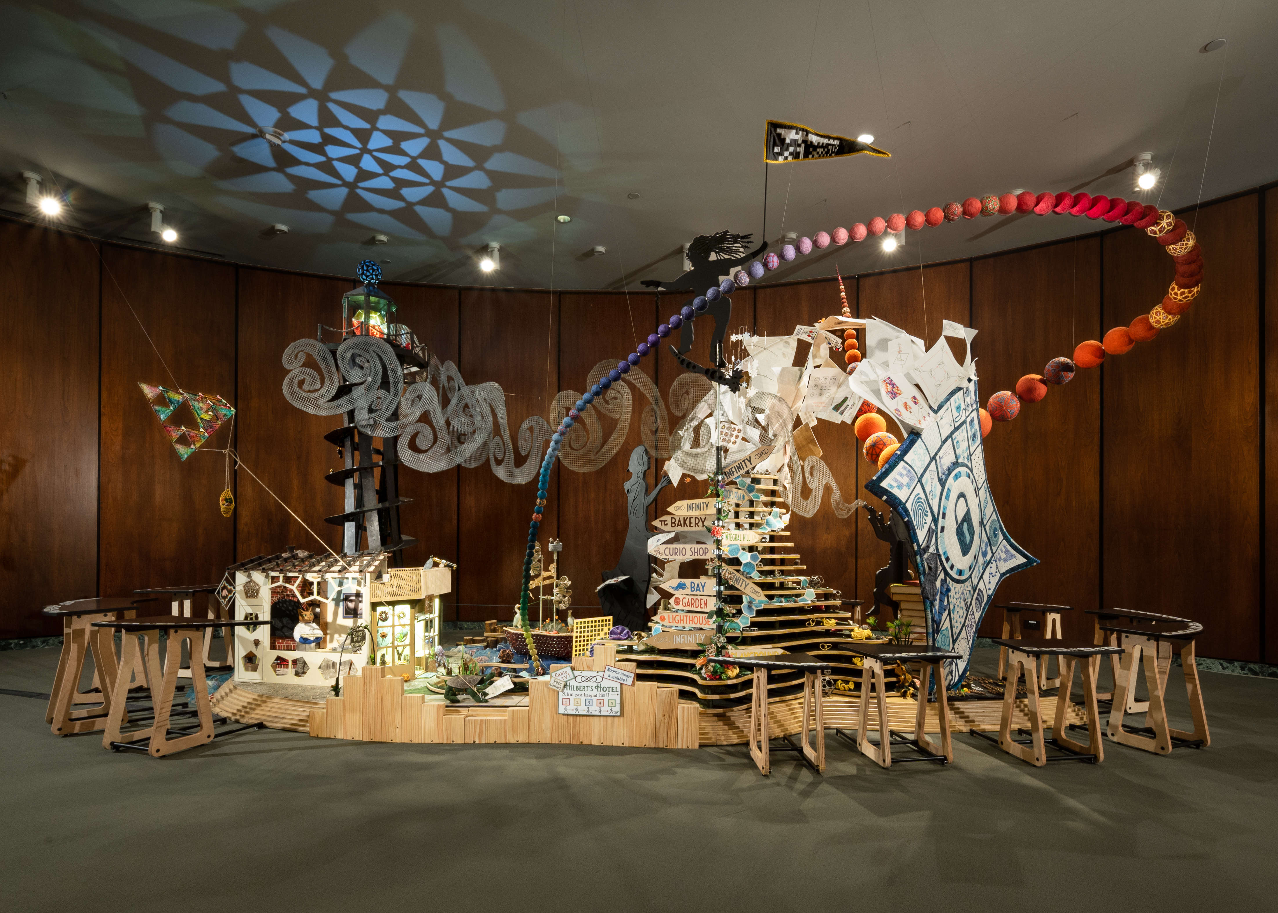 A 20 feet long, 8 feet wide and 10 feet high art installation using many media, illustrating many mathematical themes in a whimsical way